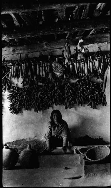 Hopi woman grinding maize