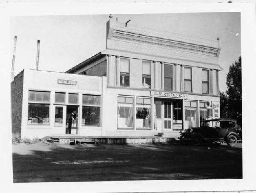 Photo of Post Office and "Co-op," Monticello, Utah. "Pecos" in rt. Foreground