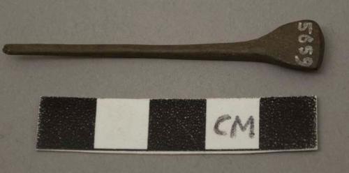 Awl shaped instrument of bone with broad flat head