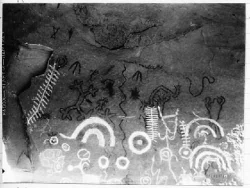 Petroglyph: rainbow, earth worm, frog man, centipedes, shield, turkey tracks