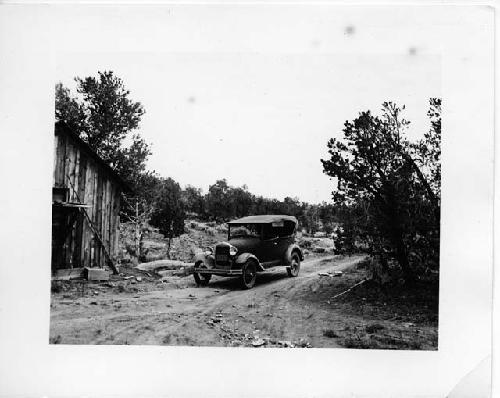 Photo of Rear of Blacks cabin and our car "Pecos."