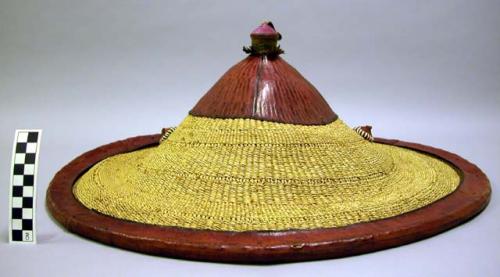 Woven hat with leather rim and finial
