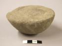 Ground stone tool? one half of round stone