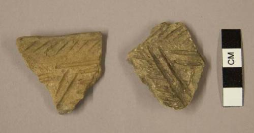 Ceramic sherds, body and rim, parallel incised designs