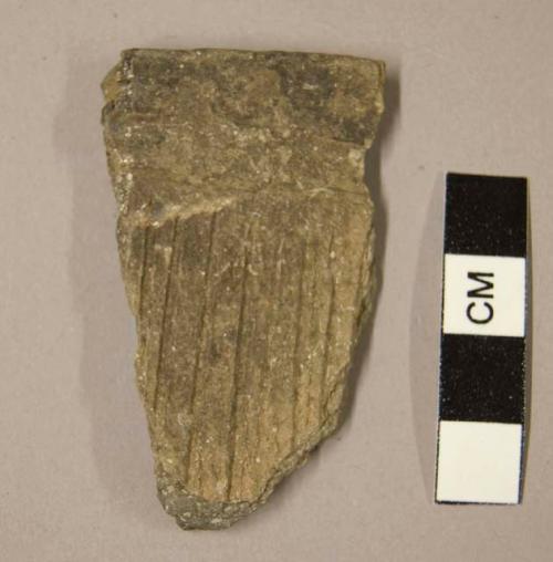 Ceramic rim sherd, parallel vertical incised lines