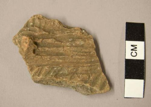 Ceramic body sherd with protrusion,  parallel incised designs