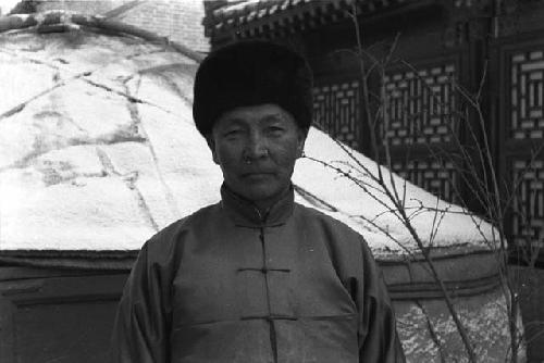 Standing in front of a yurt