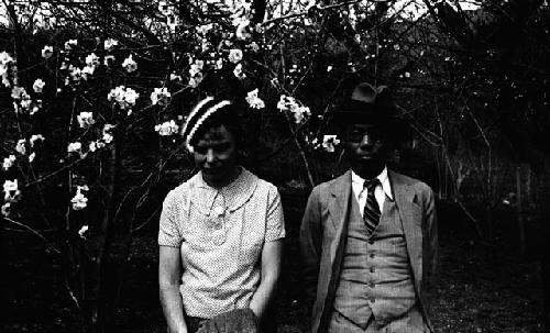 Eleanor Lattimore and Pan Tsilu by cherry blossoms