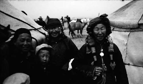 Portrait of three Ordos women and one child