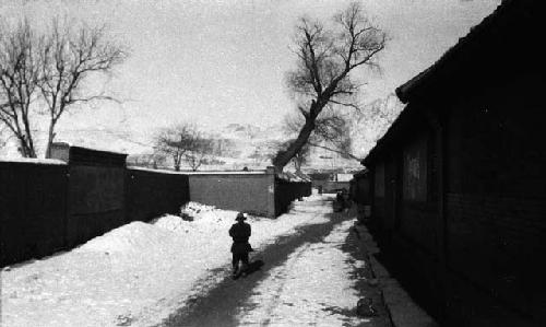 Man walking in snowy street