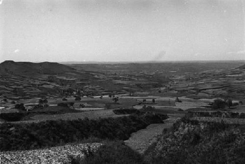 Landscape with hills, river and cultivated fields