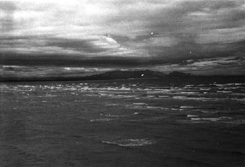 Sea with mountains in distance