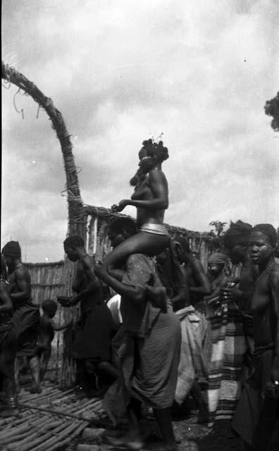 Gio girl being carried to Sande Bush