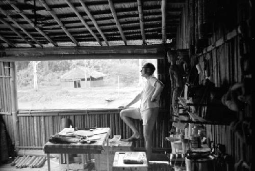 Dr. A. A. Gerbrands at a window of his house at Ammanamgai