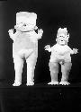 Large female and small male pottery idols