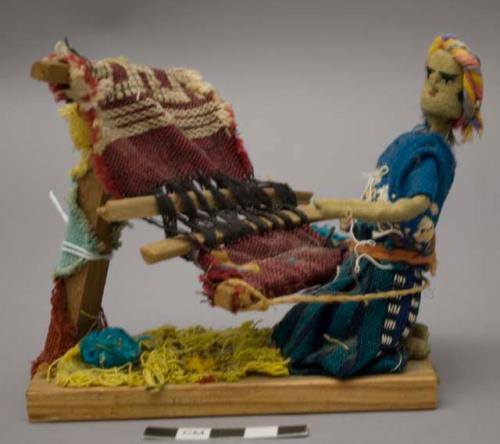 Doll, woman weaving on loom, affixed to stand