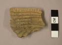 Ceramic rim sherd, parallel incised designs