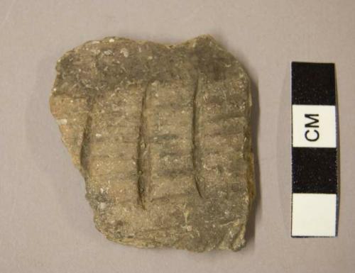 Ceramic body sherd, parallel vertical and horizontal incised lines