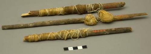 Sticks with hemp fibre, in two parts. Catalog: “pahos made from dart sharg”.