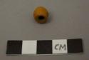 Ceramic bead, yellow, slightly cracked