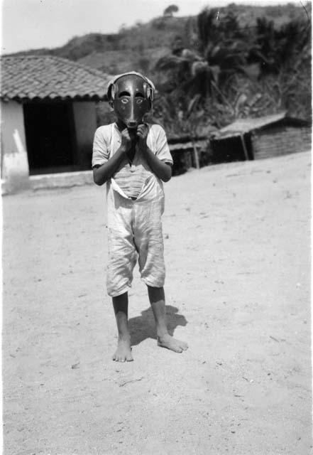Photograph of child wearing mask