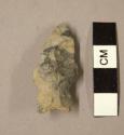 Chipped stone, projectile point, stemmed, concavity in one side