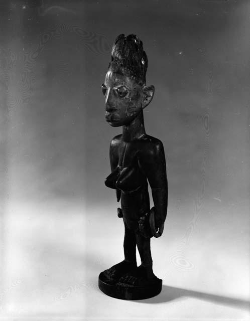 Female Ibeji of wood