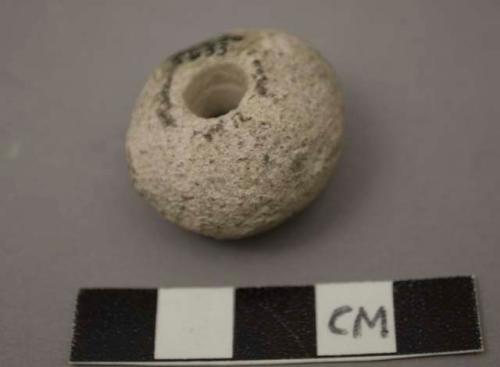 Stone beads, round, white, 1 with incised line around circumference