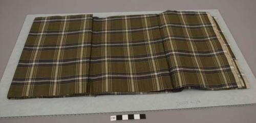 Fabric for man's longyi; olive and white plaid