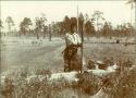 Pounding a Skin. John Ahayuchi Abbi Dressing a Skin at Bayou Lacombe, Louisiana