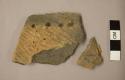 Ceramic rim sherds, one with serrated rim, four puntations, and textured surface