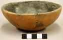 Outcurved bowl; somewhat flattened base, small fireclouds, rim repair - salt smu
