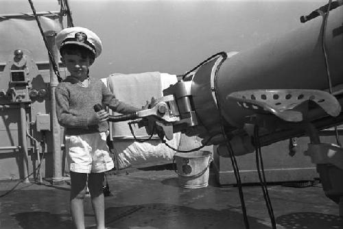 David Lattimore in sailor's cap on ship deck