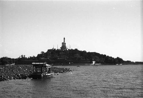 Man in covered boat in foreground