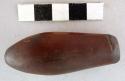 Ground stone ornament, pendant, oblong bowling-pin shape