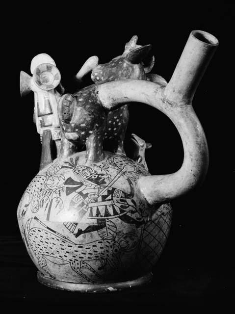 Stirrup vessel, man and dog in relief, hunt depicted on vessel