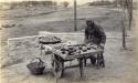 Man with cart and grains