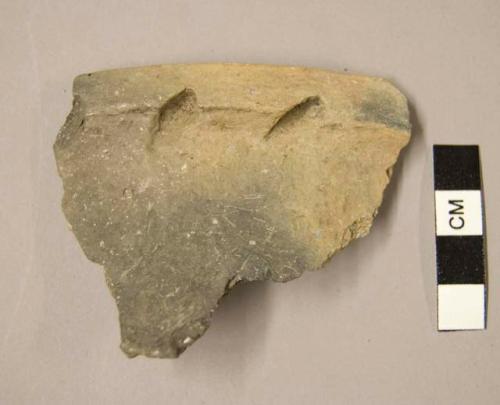 Ceramic rim sherd, three indentations along ridge of rim