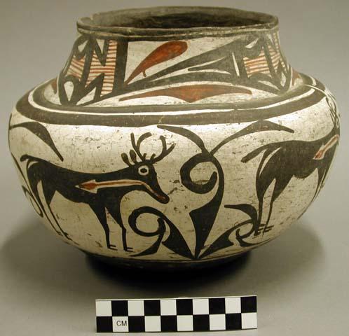 Polychrome jar. Round body w/ flat shoulder w/ neck gradually slanting inwa