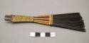 Wooden comb with woven handle