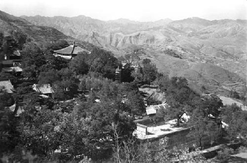 Main temple group, woods, hills beyond