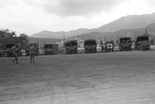 Trucks parked together side by side in lot