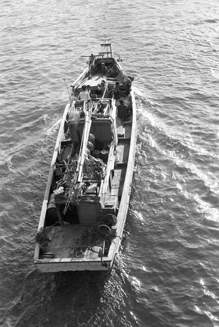 Aerial view of boat traveling in water