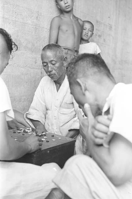 Men playing board game