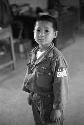 Portrait of young Korean boy in American army uniform