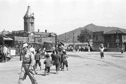 View of the street, Pedestrians and children walking