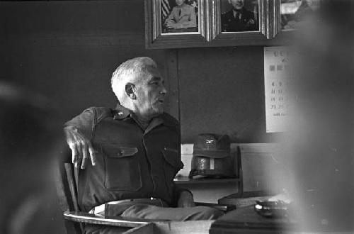 Portrait of man sitting in chair leaning back