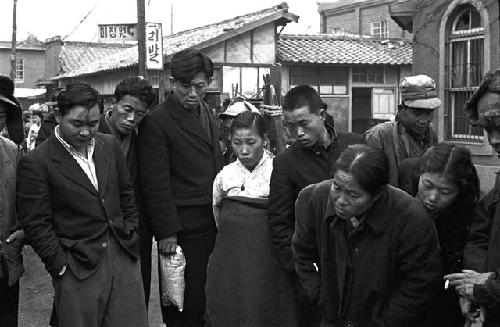 Civilians standing amongst each other