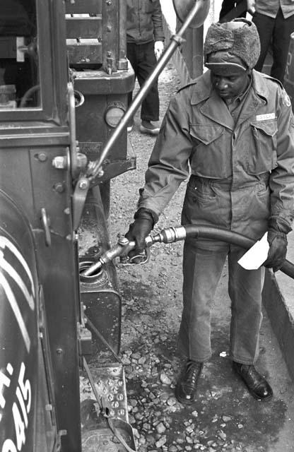 Soldier pumping gas into truck 3