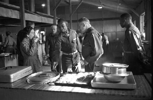 Portrait of soldiers standing by serving table 2